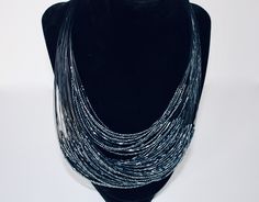 This multi-beaded, layered necklace is chic, with a bohemian flair.  The beads shimmer in the light to the tune of blue, silver, and black.  Perfect accessory for any occasion The clasp is adjustable and could also be worn as a bib necklace. From clasp to bottom beaded layer approx 11" drop Add glamour to your look! Jewelry Beads, Layered Necklace, Necklace Vintage, Bib Necklace, Vintage Costume Jewelry, Multi Strand, Layered Necklaces, Costume Jewelry, Favorite Jewelry