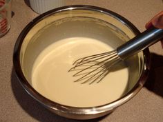 a whisk is being stirred in a bowl