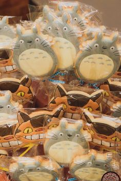 there are many decorated cookies in the shape of cats