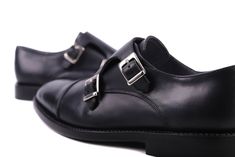 Adjustable double buckle monkstrap shoe with captoe detail at the toe. Ideal for formal or casual wear. Goodyear welt construction, leather upper and lining. Padded leather insole. Leather sole. Leather heel with rubber insert. *Can be manufactured in other colors. Please contact us for a custom quote. **The details and color in this piece may slightly vary to the ones shown, they are a result of the nature of the manufacturing process. Semi-formal Monk Strap Shoes With Rubber Sole, Black Monk Strap Shoes With Leather Sole, Monk Strap Shoes With Rubber Sole For Business, Office Monk Strap Shoes With Rubber Sole, Black Cap Toe Monk Strap Shoes, Business Monk Strap Shoes With Rubber Sole, Black Cap Toe Monk Strap Shoes For Office, Business Monk Strap Slip-on Shoes With Rubber Sole, Business Casual Monk Strap Shoes With Rubber Sole