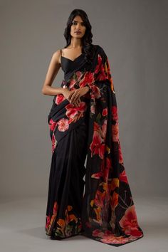 Black silk chanderi saree with all over printed floral motifs. Comes with matching unstitched blouse fabric.
Components: 2
Pattern: Printed
Type Of Work: Floral
Fabric: Silk Chanderi
Color: Black
Other Details: 
Piping on the edges
Note: Stitched blouse worn by the model is not for sale
Occasion: Mehendi and Haldi,Sangeet - Aza Fashions Black Organza Saree, Editors Note, Latest Indian Saree, Floral Print Sarees, Floral Saree, Rohit Bal, Simple Sarees, Print Saree, Utsav Fashion