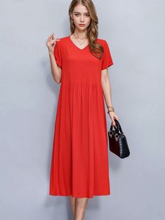 Turn heads wherever you go with this bold and elegant red A-line dress. The vibrant hue is a statement in itself, perfectly balancing boldness with timeless sophistication. Designed to flatter various body types, this dress features a relaxed fit that gently drapes over the body, offering both style and comfort. The V-neckline adds a touch of femininity, while the short sleeves ensure a casual yet polished look. One of the standout features is the inclusion of discreet side pockets, providing bo Casual Red A-line Maxi Dress, Red V-neck Maxi Dress, Red Solid Color Midi Dress For Summer, Summer Solid Color Red Midi Dress, Red V-neck Maxi Dress Solid Color, Chic Red Solid Color Midi Dress, Red Solid Color Maxi Dress For Spring, Spring Red Solid Color Maxi Dress, Red Solid Color Spring Maxi Dress