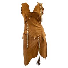 a brown dress with fringes and feathers on it