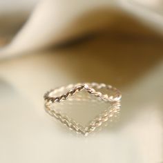 Our V-Shaped Twisted Band is the perfect blend of simplicity and style. Crafted in 14KT yellow gold, this ring features a delicate twisted design with a subtle V shape, making it a versatile addition to any jewelry collection. Whether worn on its own or paired with a gemstone ring, this piece adds a touch of elegance to any look. Designed to nestle perfectly with our Jasmine Oval Diamond Ring or Mariposa Ring, the V-shaped band creates a seamless and graceful silhouette. It’s also perfect as a s Oval Diamond Ring, Gem Diamonds, Twisted Band, Something Blue, Oval Diamond, Womens Engagement Rings, Ring Box, Gemstone Ring, V Shape