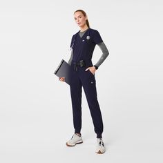 Official FIGS® Scrubs. Ridiculously Soft Scrubs Designed Just For You. Get Free Shipping On Orders $50+! | FIGS Womens Navy Uman Relaxed - Petite Jogger Scrub Pants Navy Scrubs Outfit, Figs Scrubs Outfit, Styling Scrubs, Scrub Ideas, Jogger Scrubs, Medical Scrubs Fashion, Navy Scrubs, Navy Blue Scrubs, Vest Layering