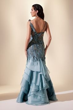 Blue sleeveless ruffle layered maxi gown with serenade stellar sequin embroidery. - Aza Fashions Elegant Blue Dress With Ruffled Straps, Elegant Tiered Ruffle Gown, Elegant Tiered Ruffled Evening Dress, Blue Tiered Dress For Gala, Elegant Evening Gown With Ruffled Straps, Blue Ruffled Evening Dress For Gala, Elegant Gown With Ruffled Straps For Gala, Elegant Evening Dress With Ruffled Straps For Gala, Elegant Blue Dress With Ruffled Skirt