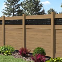 a wooden fence in front of some bushes and trees