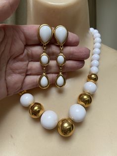 "You must have at least one set of white jewelry just for summer. White pearls don't count. I'm talking fun stuff. Necklace is signed Napier and earrings signed Trifari. Necklace will extend from 16 to 18\" with a hook clasp. Largest front beads are about 18 and 20mm round. They continue to be fairly big at about 10mm near clasp. Earrings are clip backs marked Trifari. Big look at 3\" but the largest section is against the earlobe. Not heavy anyway but I think the largest bead at top is a good i Modern White Jewelry With Pearl Drop, Modern White Pearl Drop Jewelry, Modern White Jewelry With Round Beads, Modern White Round Bead Jewelry, Classic White Jewelry With Matching Earrings, White Dangle Jewelry Sets For Formal Occasions, Classic White Jewelry Set With Matching Earrings, White Pearl Drop Costume Jewelry, Elegant White Necklaces With Matching Earrings