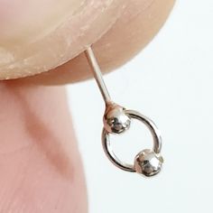 Enhance your style with this exquisite Double Ball 925 Sterling Silver Indian Nose Stud. Crafted from 100% authentic 925 sterling silver, our nose stud features a 2mm double ball design on a moving ring circle for that elegant touch. The 22g (0.6mm) x 6mm size ensures a secure and comfortable fit, perfect for daily wear. With its L-bendable closure, it provides easy and reliable application. Ideal for healed piercings, this unisex nose stud combines quality and fashion effortlessly. Purchase now Classic Car Photoshoot, Cotswolds England, Shower Wall Tile, Luxury Rv, Nose Studs, Ball Design, Circle Ring, Nose Stud, Pin Jewelry