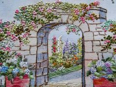 this is an image of a garden scene with flowers and plants on the outside wall