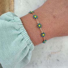 Beautiful greenish-teal flower bracelet with a 14k gold filled clasp and jumprings. Can be made in an adult size or child length with extender. Child length is made with an extender to be approximately 5.25"-6.5". Giftbox included. Perfect gift for kid birthday gifts, first communion gift, baptism gift, summer jewelry, friendship bracelets! Blue Flower Friendship Bracelets Gift, Blue Flower Friendship Bracelets, Dainty Adjustable Flower Charm Bracelet, Green Beaded Bracelets With Flower Charm For Gift, Adjustable Flower Charm Bracelet, Green Bracelet With Flower Charm As Gift, Adjustable Turquoise Flower Beaded Bracelet, Adjustable Green Flower Shaped Jewelry, Dainty Green Adjustable Bracelets