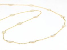 10k Yellow Gold Oval Disc Station 20 Inch Necklace. Measures approximately 1/8 of an inch in width, is adjustable from 18-20" L, and has a spring ring clasp. Adjustable Oval Jewelry Tarnish Resistant, Tarnish Resistant Adjustable Oval Jewelry, Adjustable Oval Tarnish-resistant Jewelry, Oval White Gold Necklace With Delicate Chain, Adjustable Dainty Oval Necklace, Adjustable Oval Dainty Necklace, Dainty Oval Adjustable Necklace, Dainty Oval Jewelry With Adjustable Chain, Delicate Oval 14k Gold Chain Jewelry