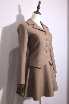 Classic Long Sleeve Skirt Suit For Tailoring, Classic Fitted Winter Skirt Suit, Classic Tailored Wool Skirt Suit, Classic Fitted Skirt Suit For Winter, Winter Formal Fitted Skirt Suit, Elegant Fitted Winter Skirt Suit, Classic Fitted Wool Skirt Suit, Fitted Wool Skirt Suit For Winter, Fitted Wool Skirt Suit For Fall