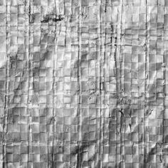 black and white photograph of an abstract background with lines in the middle, on top of a sheet of paper