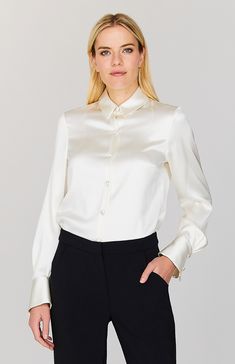 Our signature collared button down shirt is an elegant update to a wardrobe staple. Cut with a beautifully drapey and relaxed sleeve and finished with a wide angled cuff that can be worn long or folded up for maximum versatility. An easy way to add a pop of color and shine under a jacket, but strong enough to stand alone. Elegant Shirt With Button Closure For Daywear, Classic Blouse With Fold Down Collar And Buttons, Elegant Tops With Button Closure, Elegant Semi-formal Tops With Lapel Collar, Elegant Spread Collar Blouse For Fall, Elegant Tops With Buttons And Fold Down Collar, Timeless Formal Blouse With Lapel Collar, Timeless Office Blouse With Lapel Collar, Timeless Silk Shirt For Office