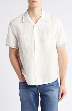 Intricate floral embroidery trimming the sleeves and collar adds an artisanal touch to a festival-ready camp shirt cut from a fresh blend of linen and cotton. 27" length (size medium) Front button closure Notched collar Short sleeves Chest patch pocket 55% linen, 45% cotton Machine wash, line dry Imported Embroidered Camp Shirt With Relaxed Fit For Vacation, Embroidered Camp Collar Shirt For Vacation, Spring Vacation Embroidered Camp Shirt, Embroidered Camp Shirt With Camp Collar For Vacation, Summer Floral Embroidered Relaxed Fit Shirt, Summer Floral Embroidery Relaxed Fit Shirt, Embroidered Vacation Tops With Camp Collar, Embroidered Camp Shirt With Relaxed Fit, Spring Linen Shirt With Johnny Collar