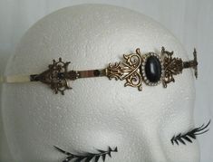 This beautiful circlet has antique brass settings, black catseye stone and rhinestone accents set on a gold tone adjustable band. Victorian Art Deco, Elven Jewelry, Hippie Rings, Turquoise Jewelry Native American, Tiara Crown, Medieval Jewelry, Southwest Jewelry, Southwestern Jewelry, Bohemian Rings