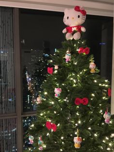 a hello kitty christmas tree with lights and decorations