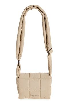 The label stays true to its ethos of creating lightweight, functional essentials with this pillowy messenger bag crafted from water-resistant recycled nylon. Top flap with interior zip closure Adjustable crossbody strap Recycled-nylon lining Recycled nylon Imported Designer Handbags Functional Beige Nylon Shoulder Bag, Beige Nylon Crossbody Shoulder Bag, Woman Bags Handbags, Crossbody Strap, Designer Handbags, The Label, Messenger Bag, Bags Handbags, Porter