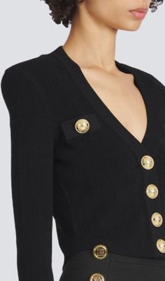 Elevate your wardrobe with this BLACK V-NECK METAL BUTTON CROPPED KNIT CARDIGAN, crafted from exquisite knit fabric for a sophisticated and stylish look. This versatile and timeless piece features a sleek V-neck, metal buttons, and a flattering cropped silhouette. A truly luxurious addition to any wardrobe. Gentle Dry Clean OnlyColour may vary due to lighting on images. The product images (without model) are closest to the true colour of the product.Item runs true to size chart and is cut to sui Chic V-neck Cardigan For Formal Occasions, Elegant Fitted V-neck Cardigan, Designer Long Sleeve Sweater For Work, Designer Fitted Sweater For Formal Occasions, Luxury Fitted Cardigan For Formal Occasions, Fitted V-neck Luxury Cardigan, Designer Formal Sweater For Fall, Designer V-neck Tops For Fall, Fitted V-neck Sweater For Formal Occasions