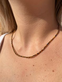 Stunning Tigers Eye dainty faceted bead choker measuring 42cm 16inches with 5cm 2inch extender chain in gold tone with small heart charm.  Manifest your dreams, focus on the good Adjustable Dainty Crystal Necklace With Faceted Beads, Crystal Necklaces With Delicate Chain And Round Beads, Dainty Faceted Bead Choker Necklace, Trendy Faceted Beads Necklaces As Gift, Gold Crystal Necklaces With Delicate Chain And Round Beads, Trendy Faceted Beads Necklace As Gift, Trendy Faceted Beaded Necklace For Gift, Trendy Faceted Beads Necklace For Gift, Dainty Adjustable Choker With Faceted Beads