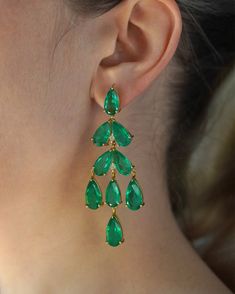 Introducing our exquisite Emerald Palace Earrings, adorned with large, captivating emerald quartz gemstones that gracefully cascade like translucent droplets, exuding an aura of refined elegance and enchantment. Style tip: Elevate your wardrobe effortlessly from day to night by adorning these divine earrings with a casual ensemble like a crisp white linen blouse and tailored trousers, infusing a touch of ethereal allure, or pair them with a sleek black evening gown for an opulent affair, emanating timeless sophistication. Indulge in the allure of enchanting elegance--immerse yourself in the delicate beauty of these beautiful earrings and embrace a world of transformative style and effortless refinement. Luxury Gemstone Earrings With Rectangular Stone, Green Drop Crystal Earrings For Party, Green Dangle Chandelier Earrings For Formal Occasions, Green Dangle Chandelier Earrings For Formal Events, Elegant Green Teardrop Chandelier Earrings, Green Emerald Dangle Chandelier Earrings, Elegant Green Gemstone Chandelier Earrings, Elegant Green Dangle Chandelier Earrings, Glamorous Green Dangle Chandelier Earrings