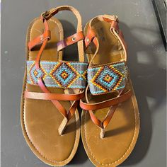 Nwot Mossimo Strappy Sandals With Boho Embroidered Pattern. Brown With Grey, Blue, Orange And Yellow Design. Flat Heel. Never Worn. Excellent Condition. Size 8. Smoke Free And Bug Free Home. No Trades. Casual Adjustable Beaded Sandals, Blue Beaded Sandals For Vacation, Casual Embroidered Beach Sandals, Bohemian Embroidered Sandals For Beach, Flat Embroidered Sandals For Beach, Casual Brown Beaded Sandals, Bohemian Embroidered Beach Sandals, Yellow Design, Boho Sandals