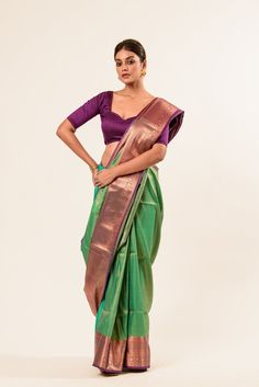 Explore our exquisite Pure Kanjivaram Silk Saree featuring a stunning dual shade of green and Maroon, adorned with intricate Zaris woven designs. Perfect for saree enthusiasts seeking timeless elegance. Festive Green Pre-draped Saree With Zari Weaving, Green Pre-draped Saree With Zari Weaving For Diwali, Green Paithani Silk Pre-draped Saree With Self Design, Green Raw Silk Pre-draped Saree With Self Design, Festive Green Paithani Silk Pre-draped Saree, Multicolor Paithani Silk Saree With Tilla, Multicolor Paithani Silk Saree With Tilla Details, Designer Green Katan Silk Pre-draped Saree, Green Traditional Wear With Cutdana Drape