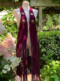 1960's Super Long Fringe Vest in Purple Suede!!  Such a Rare Find!  This is natural suede leather that has large gold grommets and studs attached. The vest is cut like a sleeveless athletic sports top with super long fringe that hangs down to the knee. Attached to the long fringe are multi colored glass beads. It's very unusual to find a purple fringe vest with incredibly long fringe like this! This brings to mind the free spirit attitude of the Hippie Movement of the Sixties and early Seventies.. Think WOODSTOCK or Haight-Ashbury in the Sixties.. home to the Love Culture, Hippies, Revolutionaries, famous singers like Jimi Hendrix & Janis Joplin.. This appears be in EXCELLENT VINTAGE CONDITION.. with no issues to mention. All of the fringe is in place. There is a label that reads: PIONEER Fringe Waistcoat, 80s Fringe Jacket, Fitted Vintage Outerwear With Fringe, Brown Bohemian Fringe Vest, Purple Fringe, Vintage Brown Fringed Outerwear, Haight Ashbury, Fringe Vest, Hippie Movement