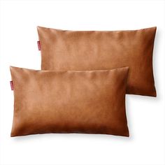 two brown pillows sitting next to each other