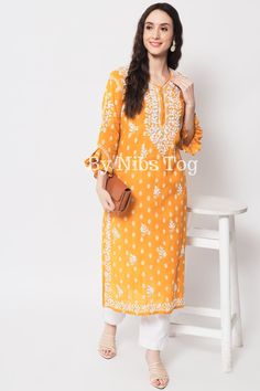 Nibs Tog Mustard Yellow Chikankari Kurti for Women Cotton with Bell Sleeves, Indian Lucknowi Chikankari Kurta Handmade Get comfy with this beautiful Chikankari Kurta for Women, made on super soft cotton fabric. The Kurta has designer Frill Sleeves to make it look for stylish. Grab it soon and check out full details below. Shop More Chikankari outfits by Nibs Tog on our Shop : https://www.etsy.com/in-en/shop/NibsTog Features: Fabric: The beautiful Chikan Kurta is made of Pure Cotton Fabric. The L Orange Bandhani Print Kurta For Eid, Orange Bandhani Kurta For Eid, Orange Bandhani Print Kurta For Diwali, Eid Orange Kurta With Bandhani Print, Orange Kurta With Chikankari Embroidery, Orange Chikankari Embroidered Straight Kurta, Semi-stitched Orange Kurta With Chikankari Embroidery, Orange Chikankari Embroidery Kurta For Diwali, Orange Straight Kurta With Chikankari Embroidery