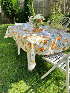 the table is set outside in the yard