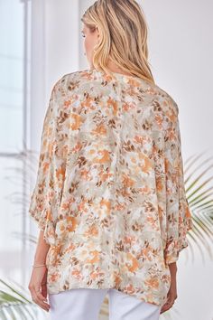 All over print on a poncho inspired blouse. Featuring a v neck, flowy bodice, and kimono inspired ruffled sleeves. Material: 100% Rayon Poncho Blouse, Ruffle Sleeve Top, Flattering Tops, Stylish Clothes For Women, Ruffled Sleeve Top, Ruffled Sleeves, Oversized Silhouette, Kimono Jacket, Floral Ruffle