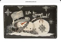 a black and white plate with a snowman wearing a hat