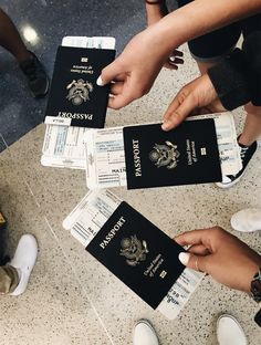 several people holding up their passport cards