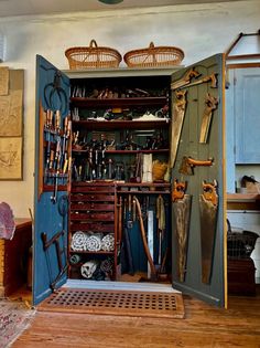 an open closet filled with lots of different types of tools and things to look at