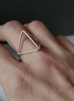 Geometry and architecture inspired this modern oxidized sterling silver ring. Edgy and minimalist, this ring is a great piece of jewelry that will enrich your look with style and originality. Extremely comfortable, it would also be a fab gift for someone really special! Please refer to the Official International Ring Size Conversion Chart, to determine your measure: http://www.ringsizes.co/ CARING FOR STERLING SILVER Sterling silver jewellery, if not worn for long periods of time, may develop a Modern Rings With Oxidized Finish For Gifts, Minimalist Oxidized Finish Promise Ring, Minimalist Oxidized Promise Ring, Handmade Minimalist Midi Rings, Minimalist Oxidized Open Ring Jewelry, Modernist Sterling Silver Rings For Everyday, Modernist Sterling Silver Everyday Rings, Minimalist Sterling Silver Ring With Oxidized Finish, Modern Handmade Sterling Silver Midi Rings