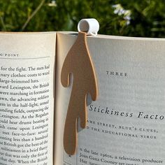 an open book with a paper cut out of it