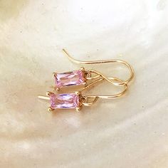 Super sweet and 'very' dainty, (TINY) elegant pale pink baguette cut drop earrings, with high quality 14k gold filled hooks, these lovely earrings are perfect for any event, as well as for gifting.   The colour is similar to rose quartz. The 'tiny' cubic zirconia 'glassy' charms (7mm long) are matched with 14k gold filled wires (not cheap gold plate)  which fit closely to your earlobe  - for information on gold fill please see FAQs - gold fill is considered to be as hypoallergenic as solid carat Small Drop Earrings, Circle Jewelry, Pink Charm, Pink Jewels, Jewellery Uk, Lovely Earrings, Pink Earrings, Baguette Cut, Small Light