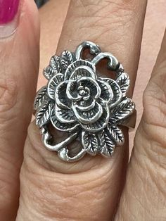 Vintage Sterling Silver Flower Ring Size 7.5. Top measures  approximately 1" x 7/8". Weighs 8.6 grams. Spring Flower Jewelry For Anniversary, Flower Shaped Anniversary Rings For Spring, Vintage Rings For Spring Gift, Adjustable Flower-shaped Ring With Rose Design, Silver Flower-shaped Rings With Rose Design, Silver Flower Shaped Rings For Spring, Silver Flower-shaped Rings For Spring, Vintage Adjustable Flower Ring For Spring, Vintage Flower Ring For Spring Gift