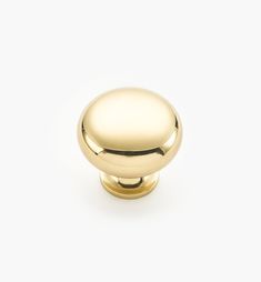 an image of a gold knob on a white background