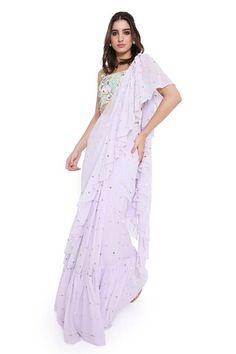 Lavender pre-draped mukaish work ruffled saree. Paired with a floral applique work blouse. - Aza Fashions Fitted Ruffled Saree, Draped Blouse With Ruffles, Summer Wedding Saree With Ruffles, Summer Wedding Pre-draped Saree With Ruffles, Summer Wedding Pre-draped Ruffled Saree, Pre-draped Georgette Dress With Ruffles, Summer Fitted Saree With Ruffles, Fitted Georgette Pre-draped Saree For Spring, Spring Elegant Georgette Pre-draped Saree