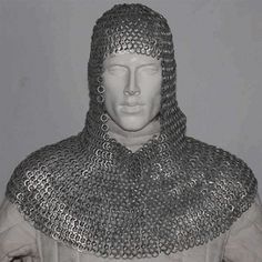 a white mannequin wearing a chainmail armor