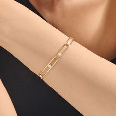 Upgrade your look with our Bezel Setting Double Wire Bubble Cuff. This exquisite bangle seamlessly marries classic elegance with contemporary flair. Its radiant gold bezel setting beautifully complements the dazzling stones, creating a captivating play of light. Whether you're dressing up for a special event or adding a touch of luxury to your everyday look, this bangle effortlessly combines timeless charm with modern allure. - Made in 14k solid gold - Decorated with handset white cubic zirconia White Gold Bracelet Women, Bangles Aesthetic, Modern Bangle, Sunburst Ring, Baguette Earring, Trendy Jewellery, The Dazzling, Wire Cuff, Celtic Knot Ring