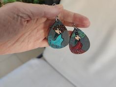 100% Handmade and hand-painted Earrings named "dancers of love", delivered from a small business in Greece. It is a unique design for nature lovers. One of a kind painted art accessory for you! This painted earrings is always a different gift choice, it can be an ideal gift for nature lovers, a birthday gift, a Christmas gift, a valentine's day gift, a mother's day gift, a teacher's day gift. Every product is original and handmade with love and will carefully be delivered to you. Hand Painted Earrings, Teachers Day Gifts, Painted Earrings, Hand Painted Jewelry, Gifts For Nature Lovers, Art Accessories, Artistic Jewelry, Nature Lovers, Mother's Day Gift