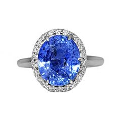 A Breathtakingly Striking  HANDMADE 14k White Gold Ring with Beautiful Oval cut Sapphire in Blue color! The GEM is 5.87 CT and measures 11.07x9.24x6.82 mm! This Stone will take your breath away, especially on the sunlight! You will want to look at this stone endlessly. The mounting is a masterpiece! HANDMADE 14K White Gold Mounting (tested), that was is custom made to Accommodate this Beauty of a Gem in Prongs setting! Super FINE Workmanship on the Diamond prong  setting with 22 pcs Brilliant Full Cut Diamonds in GH color, SI1 clarity, totaling to approx 0.38 ct ! Fabulous Braided Band and Diamond Gallery! The Entire Top's outline is 13.7x12.3 mm- HUGE. The Ring weights 5.3 g, nice and SOLID. Sits 8.2 mm off the top of the finger. Finger size 7 (Free Re-sizing with purchase). Center Stone: Oval Diamond Gemstones For Formal Occasions, Oval Center Stone Gemstones For Formal Occasions, Formal Oval Diamond Gemstones, Oval Gemstones With Halo Setting For Formal Occasions, Oval Platinum Gemstone With Center Stone, Luxury Oval Gemstones With Halo Setting, Luxury Oval Platinum Gemstones, Oval Gemstones With Prong Setting For Formal Occasions, Oval Gia Certified Sapphire Ring For Formal Occasions