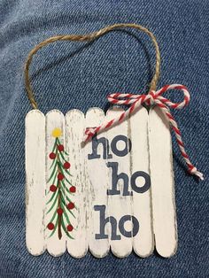 a wooden sign that says no ho hoo with a christmas tree on it