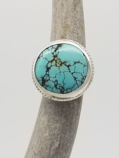 Chinese Turquoise statement ring. This is a cast piece and was one of my first. I made it before I knew how to solder. Many pieces from the early days had been melted back down for recycling due to beginners errors. This made it! Handmade Turquoise Round Ring, Artisan Turquoise Ring, Unique Round Turquoise Ring, Artisan Turquoise Ring With Patina, Blue Artisan Turquoise Ring Nickel Free, Artisan Turquoise Cabochon Ring, Artisan Turquoise Ring Round Collectible, Unique Adjustable Turquoise Ring With Patina, Untreated Round Turquoise Bohemian Ring