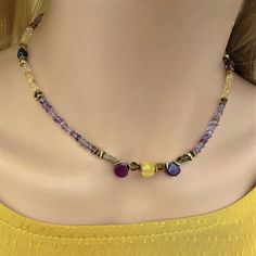 Mixed gemstone beaded necklace choker. Nice combination of natural stones original small button shapes citrine and amethyst (3mm.) with 18k. gold filled beads.  Central stones of necklace in citrine and amethyst briolette. This statement necklace will bring a nice original and colorful touch to your outft. Necklace assembled on a very durable jewelry wire. Adjustable length 15.4inch. + 2 in. extension chain. Nickel-free stainless steel lobster clasp. Purple Colorful Beads Choker Jewelry, Purple Colorful Beaded Choker Jewelry, Yellow Gemstone Beaded Necklaces As Gift, Yellow Gemstone Beaded Necklace For Gifts, Multicolor Faceted Bohemian Jewelry, Multicolor Adjustable Amethyst Necklace, Citrine Gemstone Beads For Jewelry Making, Multicolor Amethyst Gemstone Beaded Necklaces, Multicolor Amethyst Beaded Necklaces As Gifts