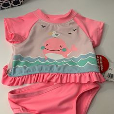 Whale W/Bird Two Piece Set. Upf 50 Size: 12 Months,18m Or 24 Months 88% Polyester 12% Spandex Code:3091 Poshmark 1 Playful Pink Swimwear For Playwear, Cute Swimming Sets For Beach Season, Cute Pink Swimwear For Pool, Pink Short Sleeve Swimwear For Beach Season, Pink Swimming Sets For Summer, Summer Swimwear With Short Sleeves For Playtime, Pink Short Sleeve Sets For Beach Season, Cute Pink Swimwear For Playtime, Pink Swimming Sets For Beachwear